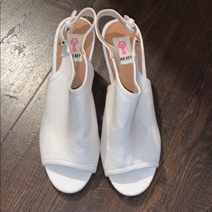 Pink key heels with gold buckle around ankle!